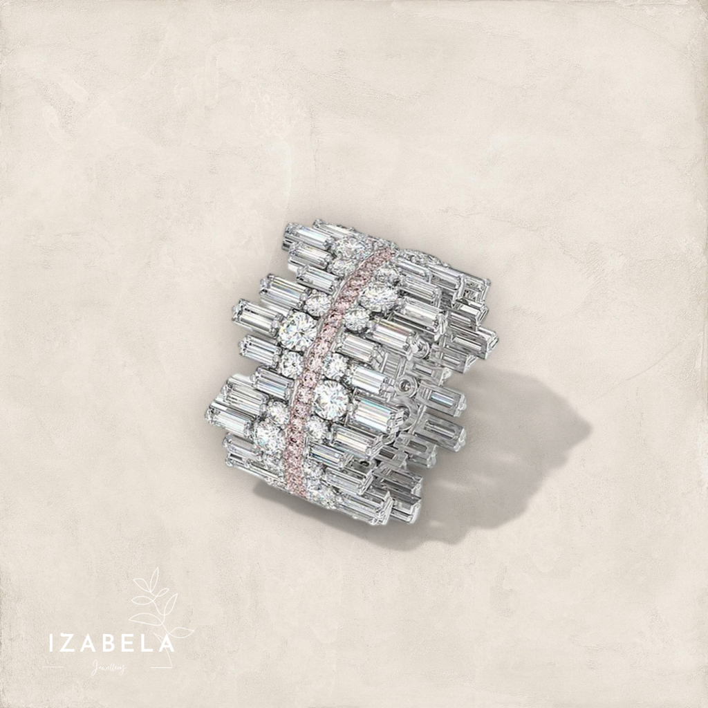 Elegant diamond ring with 'IZABELA' branding on a light beige background